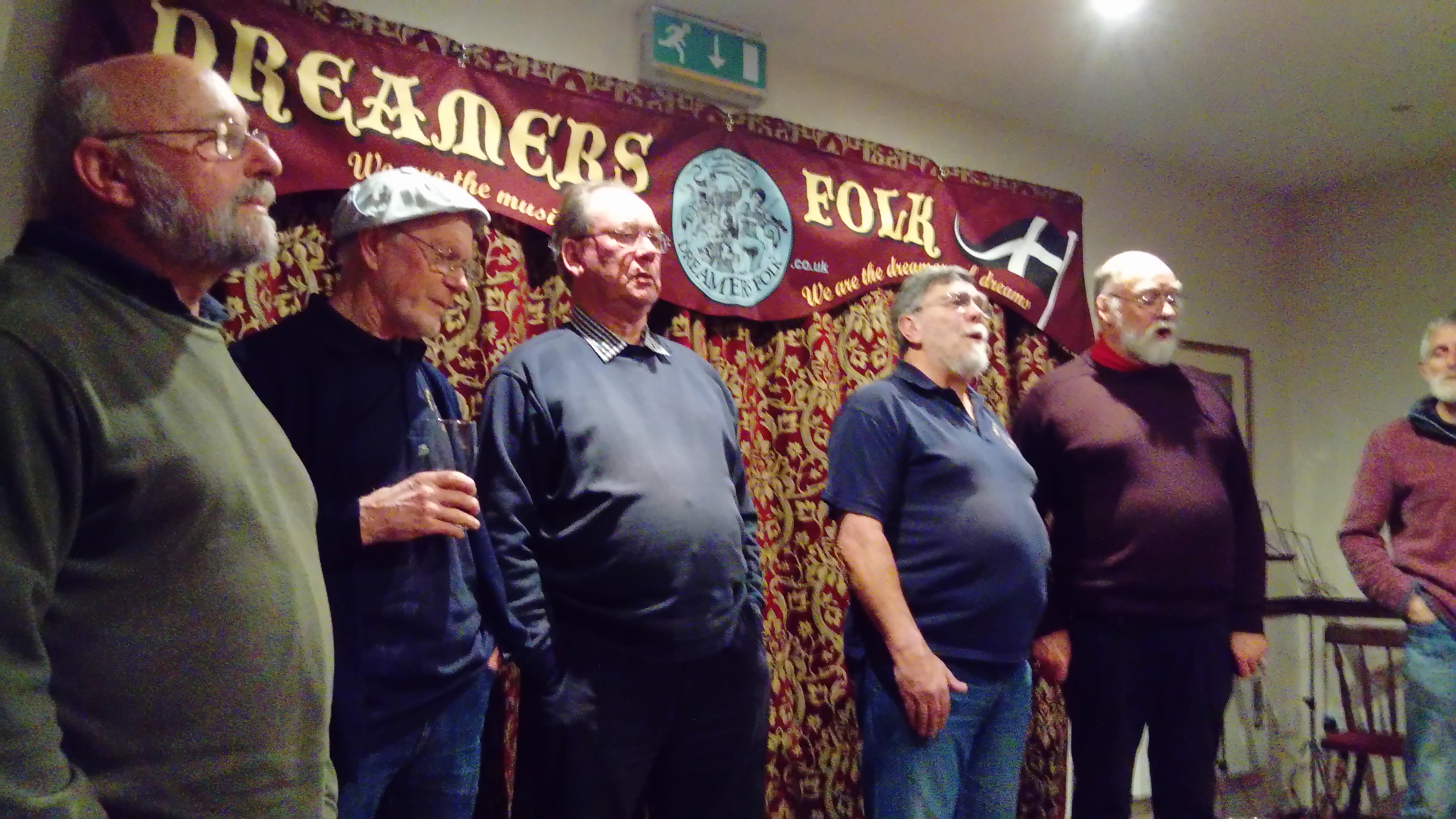 Men singing at Dreamers Folk