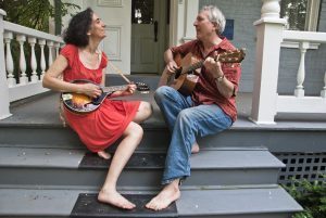 musicians sitting on the porch steps